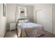 Cozy bedroom with a comfortable bed, soft carpet, and a window for plenty of natural light at 210 Westcott Ct, Deland, FL 32724