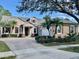 Beautiful one-story home with a brick driveway, a two-car garage and well-maintained landscaping at 210 Westcott Ct, Deland, FL 32724