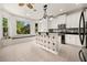 Eat-in kitchen with white cabinetry, granite counters, a large island, and a sunlit breakfast nook at 210 Westcott Ct, Deland, FL 32724