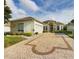 Beautiful home with a large driveway and well-manicured lawn at 17787 Se 114Th Ave, Summerfield, FL 34491