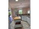 Bright kitchen features granite countertops, white cabinetry, and stainless steel appliances at 3425 Dixon Ln, The Villages, FL 32162