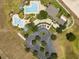 Aerial view of community pool, clubhouse, parking, and recreational area at 4088 Kingsley St, Clermont, FL 34711
