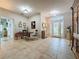 Welcoming foyer with decorative glass doors and beautiful tile flooring at 4088 Kingsley St, Clermont, FL 34711