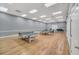 Spacious game room with ping pong tables and ample space for recreational activities at 4088 Kingsley St, Clermont, FL 34711