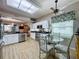 Kitchen with stainless steel appliances, white cabinets, and a view into dining area at 4088 Kingsley St, Clermont, FL 34711