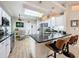 Kitchen with granite countertops, stainless steel appliances, and breakfast bar seating at 4088 Kingsley St, Clermont, FL 34711