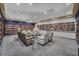 Cozy library featuring an extensive collection of books, comfortable seating, and ample lighting at 4088 Kingsley St, Clermont, FL 34711