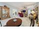 Spacious living room features tile floors, comfortable seating, and a stylish display cabinet at 4088 Kingsley St, Clermont, FL 34711