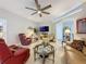 Comfortable living room featuring tile floors, ceiling fan and stylish furnishings at 4088 Kingsley St, Clermont, FL 34711