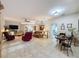 Inviting living room with a ceiling fan, tile flooring, and comfortable seating at 4088 Kingsley St, Clermont, FL 34711