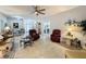 Open living room with tile floors, ceiling fan and comfortable seating at 4088 Kingsley St, Clermont, FL 34711