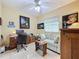 Bright office with a striped sofa and a large window with decorative window treatment at 4088 Kingsley St, Clermont, FL 34711