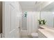 Bright bathroom features a shower-tub combo, vanity, and plants at 5279 Bowline Ct, Oxford, FL 34484