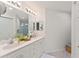 Bright bathroom features a double vanity with sleek fixtures, and an enclosed shower at 5279 Bowline Ct, Oxford, FL 34484