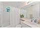 Bright bathroom features a shower-tub combo, vanity, and decorative accents at 5279 Bowline Ct, Oxford, FL 34484