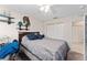 A comfortable bedroom with a ceiling fan, a closet and a bed at 5279 Bowline Ct, Oxford, FL 34484
