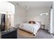 This bedroom has neutral decor and a ceiling fan at 5279 Bowline Ct, Oxford, FL 34484