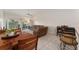 Bright living room offering tile floors, comfortable seating, and views of the lanai at 5279 Bowline Ct, Oxford, FL 34484