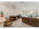 Open-concept living room features high ceilings, tile flooring, and a comfortable seating area at 5279 Bowline Ct, Oxford, FL 34484