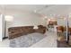 Spacious living room with tile flooring, a cozy sectional, and access to outdoor space at 5279 Bowline Ct, Oxford, FL 34484