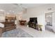Open-concept living room connects to kitchen and dining areas, with tile flooring throughout at 5279 Bowline Ct, Oxford, FL 34484