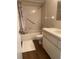 Bathroom with tub, shower, vanity, and floral curtain at 10423 Se 176Th St, Summerfield, FL 34491