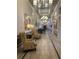 Elegant community hallway with seating and chandeliers at 119 Crescent Moon Dr, Groveland, FL 34736