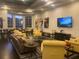 Relaxing lounge area with comfy yellow sofas at 119 Crescent Moon Dr, Groveland, FL 34736