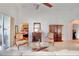 Spacious living room with ceiling fan, tile floors, and sliding glass doors to the outdoors at 119 Crescent Moon Dr, Groveland, FL 34736