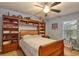 Cozy bedroom with built-in bookshelves, soft lighting, and a comfortable bed at 13412 Fox Glove St, Winter Garden, FL 34787
