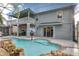 Back exterior view of a screened-in pool with a large patio at 13412 Fox Glove St, Winter Garden, FL 34787