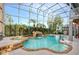 Inviting screened-in pool with waterfall feature, adjacent spa, and ample deck space for entertaining at 13412 Fox Glove St, Winter Garden, FL 34787