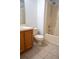 Bathroom featuring a shower-tub combo, toilet, and vanity with tile flooring at 1836 Ridge Valley St, Clermont, FL 34711