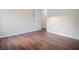 Bedroom with wood floors, neutral walls and doorway at 1836 Ridge Valley St, Clermont, FL 34711