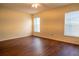 Bedroom featuring wood floors, neutral walls, and window with blinds at 1836 Ridge Valley St, Clermont, FL 34711