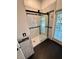 Bathroom features a frameless glass shower with sleek black hardware and modern tiling at 24124 Robinwood St, Leesburg, FL 34748