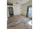 This dining area showcases updated flooring, a modern chandelier, and natural light from a nearby window at 24124 Robinwood St, Leesburg, FL 34748