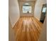 This home office has bright natural light and hardwood floors at 24124 Robinwood St, Leesburg, FL 34748