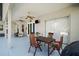 Spacious covered patio with ceiling fans, outdoor seating, and sliding glass doors to bring the outside in at 24124 Robinwood St, Leesburg, FL 34748