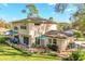 Charming backyard with patio, lush lawn, and well-maintained landscaping providing a serene outdoor living space at 1405 Hilltop Dr, Mount Dora, FL 32757