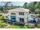 Spacious backyard with patio, seating area, and well-maintained lawn at 1405 Hilltop Dr, Mount Dora, FL 32757