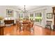 Charming dining room with tile floors, a chandelier, and a door to the backyard at 1405 Hilltop Dr, Mount Dora, FL 32757