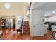 Open foyer with terracotta tile floor and decorative staircase at 1405 Hilltop Dr, Mount Dora, FL 32757