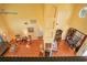 Open concept living room with high ceilings, terracotta tile, and traditional furnishings at 1405 Hilltop Dr, Mount Dora, FL 32757