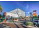 Crosswalk perspective shows shopping and dining district lined with businesses at 1405 Hilltop Dr, Mount Dora, FL 32757