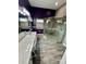 Bright bathroom features a glass-enclosed shower, updated vanity, and modern lighting at 3721 Plantation Blvd, Leesburg, FL 34748