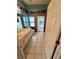 Bathroom with double sinks, a mural along the wall, and access to a sunroom with lots of light at 3721 Plantation Blvd, Leesburg, FL 34748