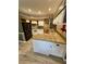 Kitchen features granite countertops, white cabinetry, stainless steel appliances, and view to the dining area at 3721 Plantation Blvd, Leesburg, FL 34748
