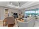 Living room with sectional sofa and sliding glass doors to the outdoors at 8724 Bridgeport Bay Cir, Mount Dora, FL 32757