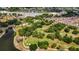 Aerial view of property near lush landscaping, golf course and many local amenities at 956 Chula Ct, The Villages, FL 32159